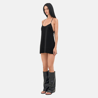 LINDSEY Mini Dress side view showing fluid black satin silhouette and halter strap construction