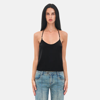 LINDSEY Top in black satin with scoop neckline and halter straps, styled with blue jeans
